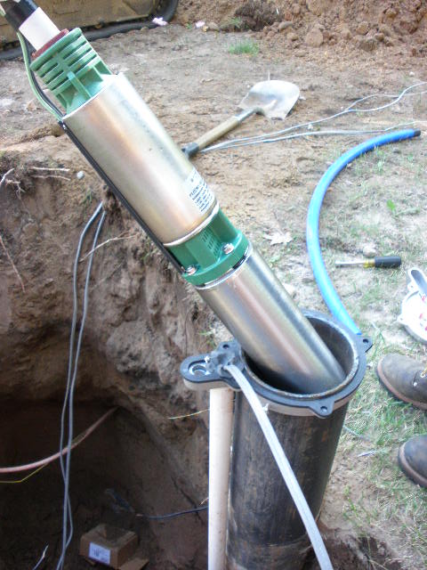 Submersible pump being lowered into the new well